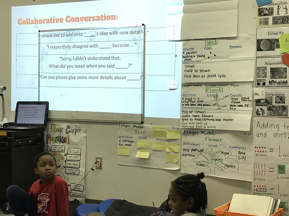 Second graders practice “collaborative conversations” as they work on a unit about pollinators. (Photo credit: StandardsWork)