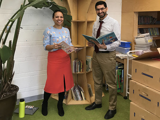 Silas Kulkarni and Principal Adrian Monge in the Ellen DeGeneres Library at Detroit Achievement Academy.